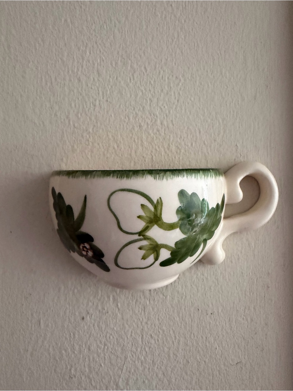 White Ceramic Wall Pocket with Green Floral Motif